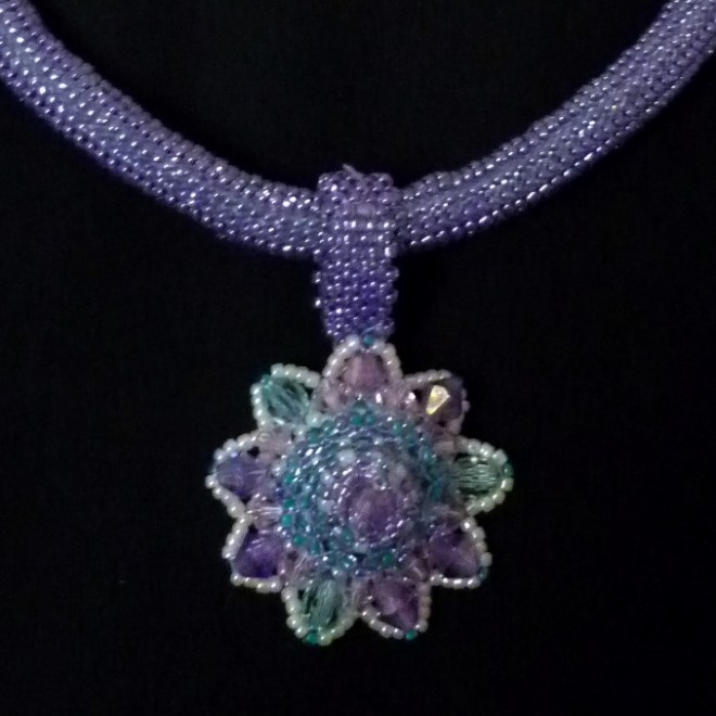 beaded necklace in purple and turquoise star